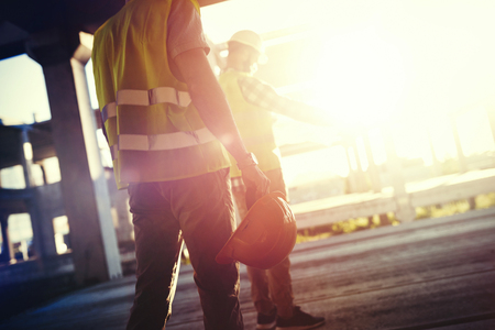 Portrait of construction engineers working on building siteの写真素材