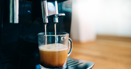 Coffee machine making coffee in morning with cremaの写真素材