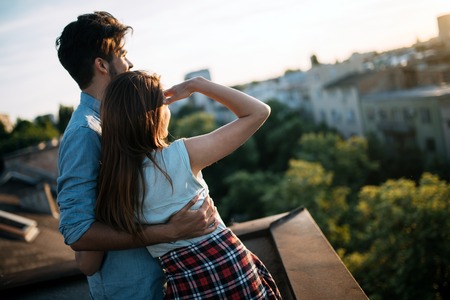 Beautiful couple in love dating outdoors and smilingの写真素材