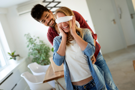 happy couple having fun while moving inの写真素材