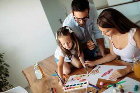 Happy family having fun time at homeの写真素材