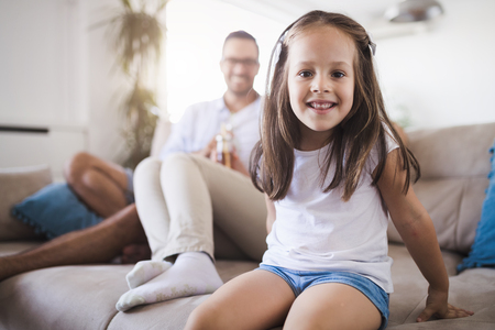 Happy family having fun time at homeの写真素材