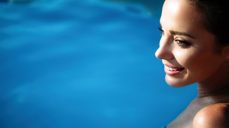 Beautiful woman sunbathing in summerの写真素材