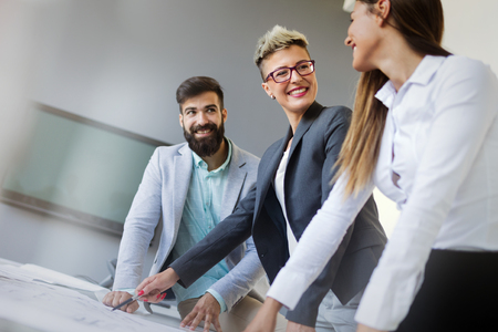 Group of business people collaborating in officeの写真素材