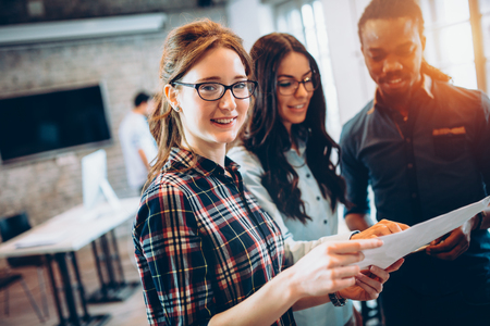 Portrait of architects having discussion in officeの写真素材