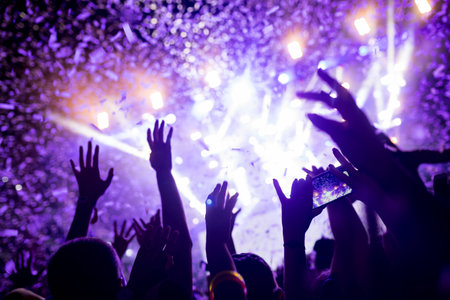 Portrait of happy crowd enjoying at music festivalの写真素材