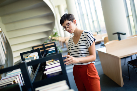 Happy woman at the libraryの写真素材