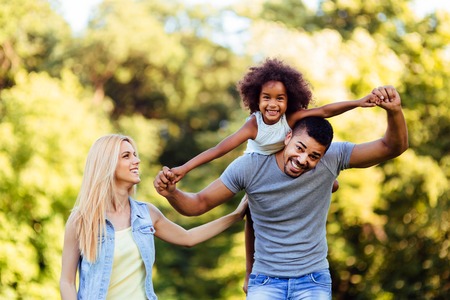 Picture of happy young couple spending time with their daughterの写真素材