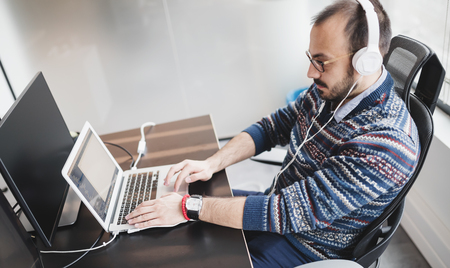Software engineer programming in office