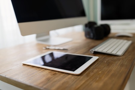 Picture of office desk with tablet computer and other accessoriesの写真素材
