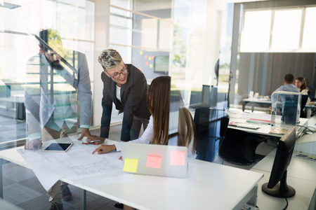 Business people working on laptop computer in officeの写真素材