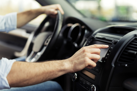 Man Using Gps Navigation System In Car to travelの写真素材