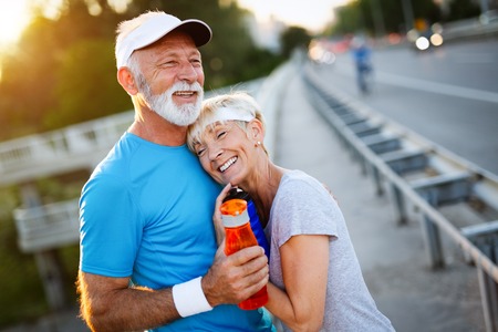 Mature couple is doing sport outdoors. Healthy lifestyle conceptの写真素材