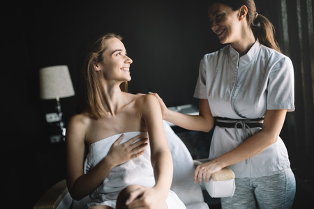 Woman enjoying skin and face treatment and massageの写真素材