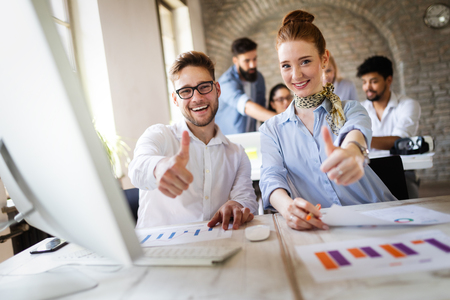 Successful happy group of people learning software engineering and business during presentationの写真素材