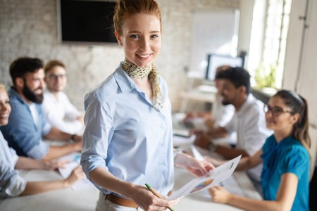 Startup business team on meeting in modern bright office interior brainstorming, working on computerの写真素材