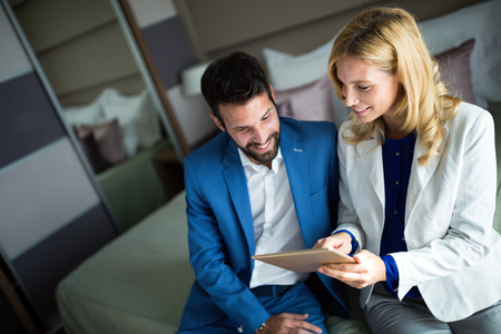Businesspeople on business trip staying in hotelの写真素材