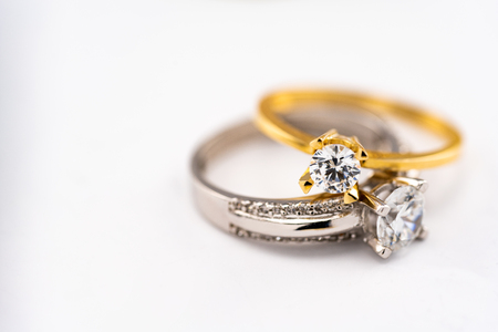 Engagement diamond wedding ring group on white background, diamond, golden ringsの写真素材
