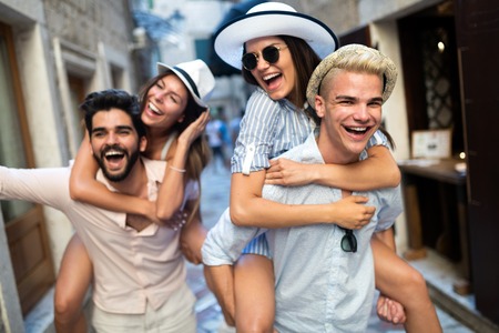 Group of young friends hangout on city streetの写真素材