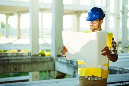 Picture of construction site engineer looking at planの写真素材