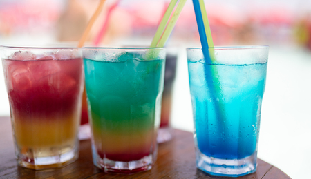 Exotic summer drinks cocktails served. Blur beach as backgroundの写真素材