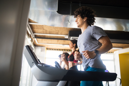 Group of healthy fit people at the gym exercisingの写真素材