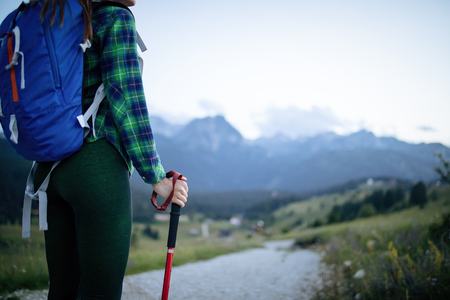 Young woman hikes in the mountain with beautiful viewの写真素材