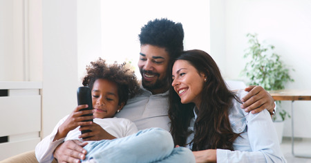Cute african american family enjoying time together.の写真素材