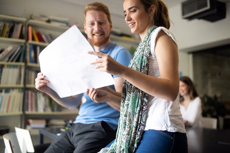Group of business people collaborating on project in officeの写真素材