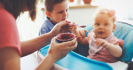 Happy young family, mother with two childrenの写真素材