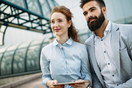 Business partners workmate couple talking in an urban cityの写真素材
