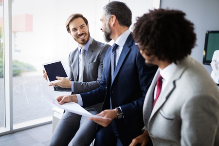 Successful team leader and business owner leading informal in-house business meeting