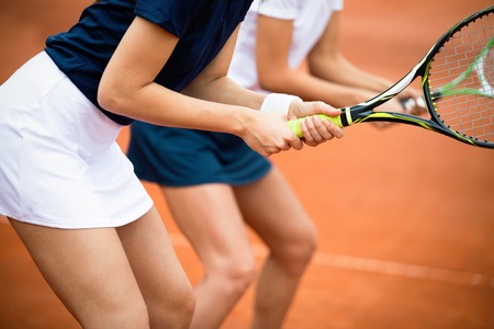 Fit happy poeple playing tennis together. Sport conceptの写真素材