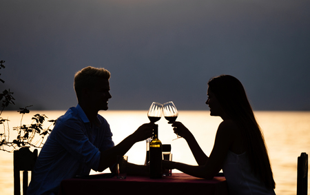 Young couple have romantic evening on sea beachの写真素材