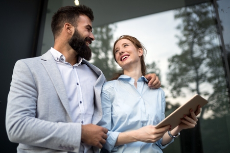 Business people walking and talking outdoorの写真素材