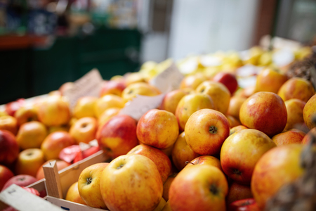 Fresh organic apple in market. Closeup backgroundの写真素材