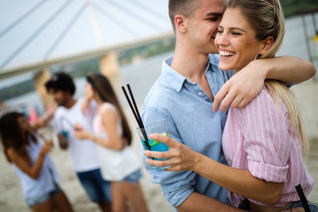 Group of young friends enjoying outdoor summer partyの写真素材