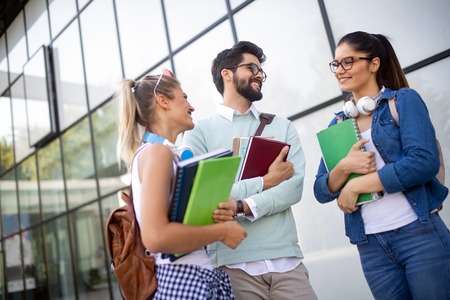 Happy group of students studying and learning together in collegeの写真素材