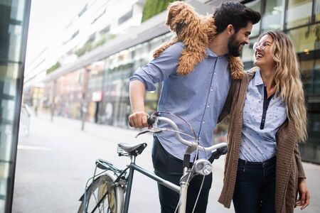 Happy couple dating on sunny day in the cityの写真素材