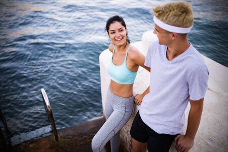 Outdoor portrait of group of friends running and jogging in natureの写真素材