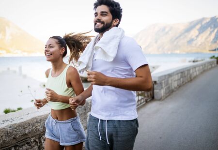 Friends fitness training together outdoors living active healthyの写真素材