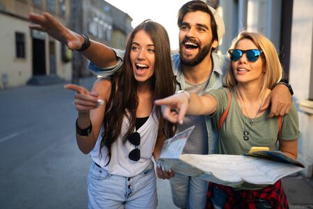 Group of smiling friends traveling. Friendship, travel, vacation, summer and people concept.の写真素材