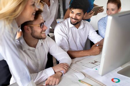 Group of young businesspeople or designers work with new startup project in office