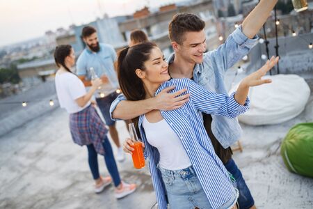 Happy lovely couple having fun time at partyの写真素材
