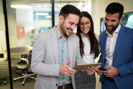 Picture of businesspeople using digital tablet in officeの写真素材