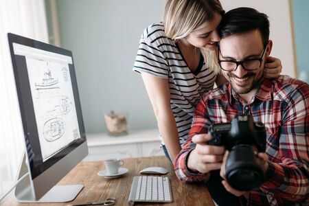 Young attractive designers working on project togetherの写真素材