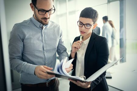 Business people planning strategy in office togetherの写真素材