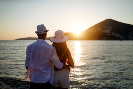 Romantic couple in love enjoying vacation on beach at summerの写真素材