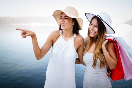 Luxurious life for two women walking and shopping on vacationの写真素材