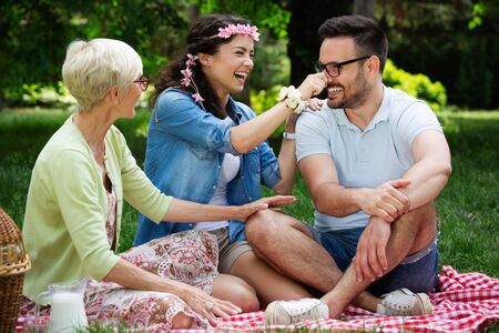 Happy family having picnic in park outdoors